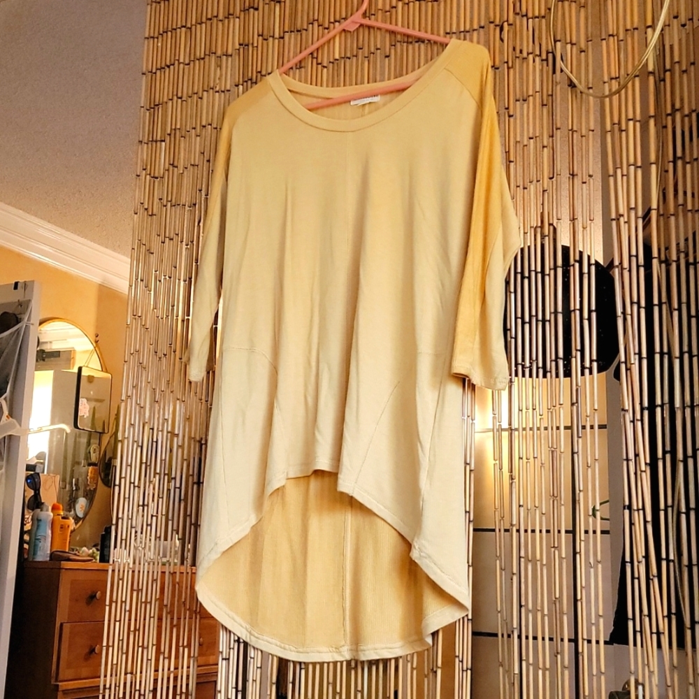 Earthbound Yellow Shirt Drop Tail scoop in back.